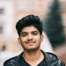 handsome-young-indian-student-man-holding-notebooks-while-standing-street (2)
